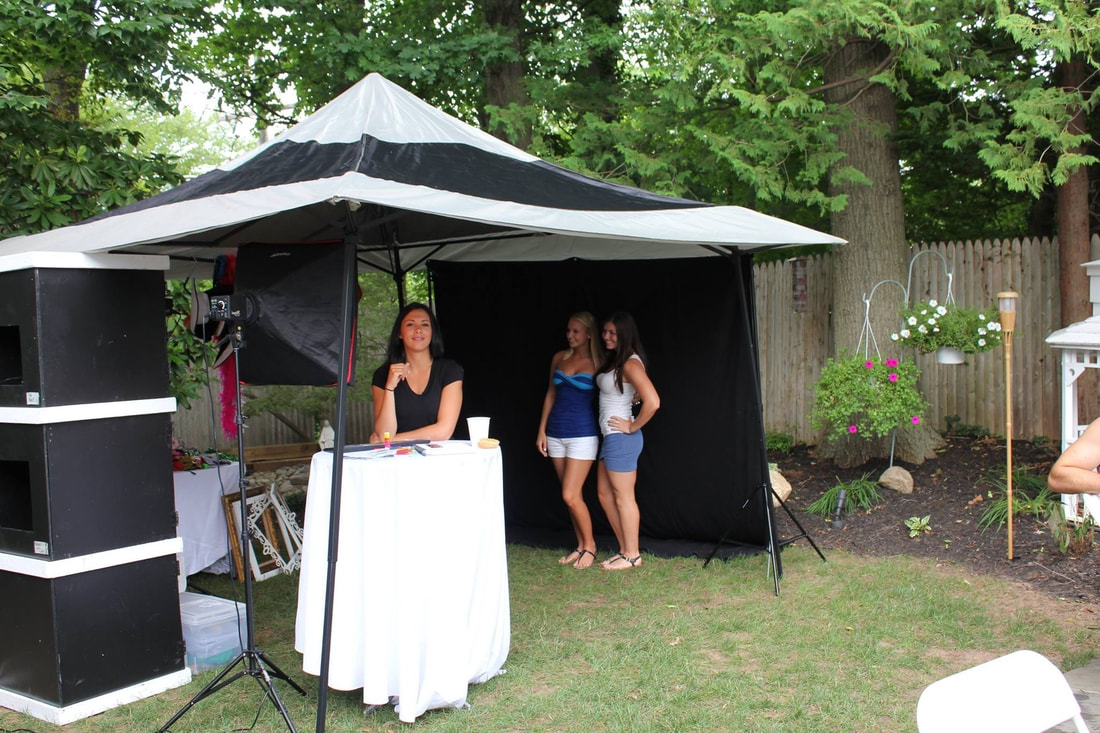 customers enjoying the outdoor photo tent